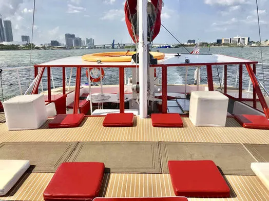 Clean, spacious non-skid teak-style deck with lounge seats on 60ft Catamaran Mariah