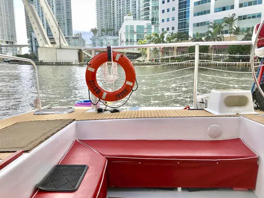Aft seating bench and life ring on the 60ft Catamaran Mariah in Miami