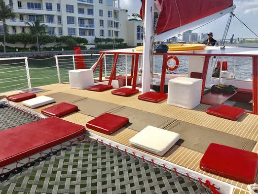 Comfortable forward lounge area with cushions and netting on 60ft Catamaran Mariah