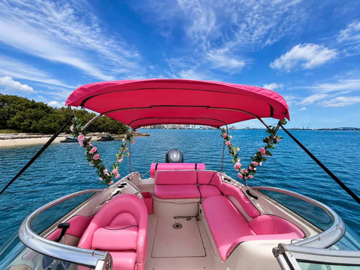 26ft pink Sea Ray Miami cockpit seating under the pink shade top
