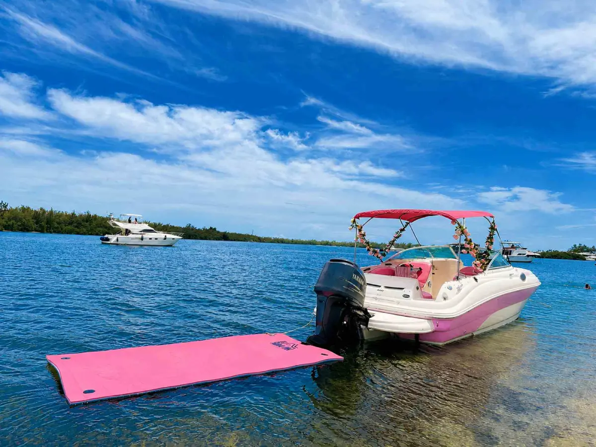 Pink floating mat behind the 26ft pink Sea Ray Miami
