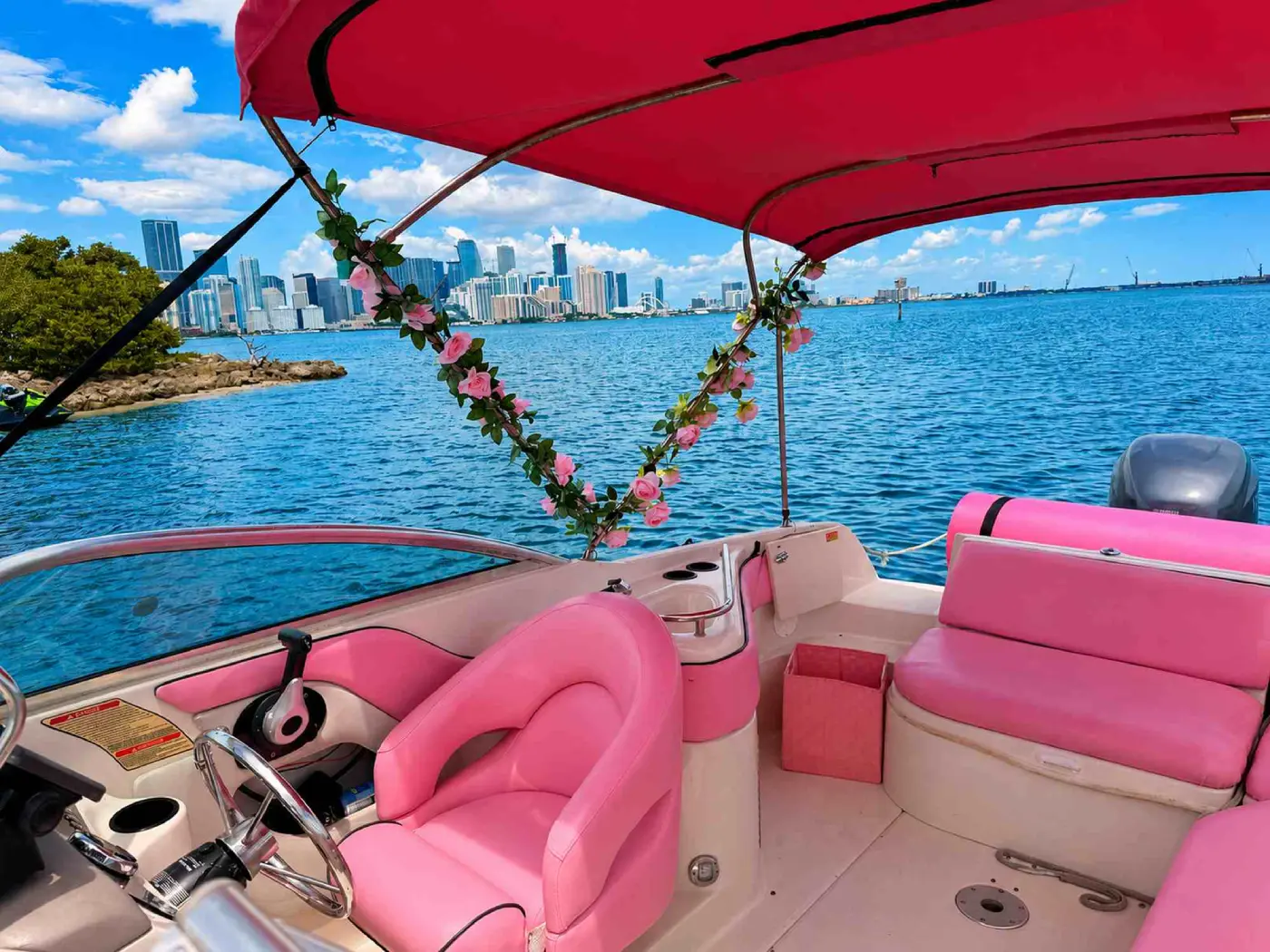 26ft pink Sea Ray Miami helm and pink seats with a downtown Miami view