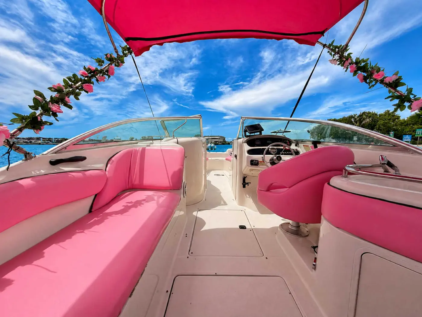 26ft pink Sea Ray Miami open deck with pink bench and helm