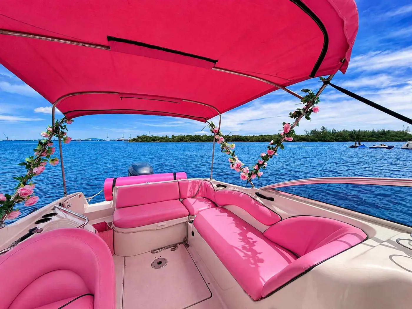 26ft pink Sea Ray Miami rear lounge seating with flower garland
