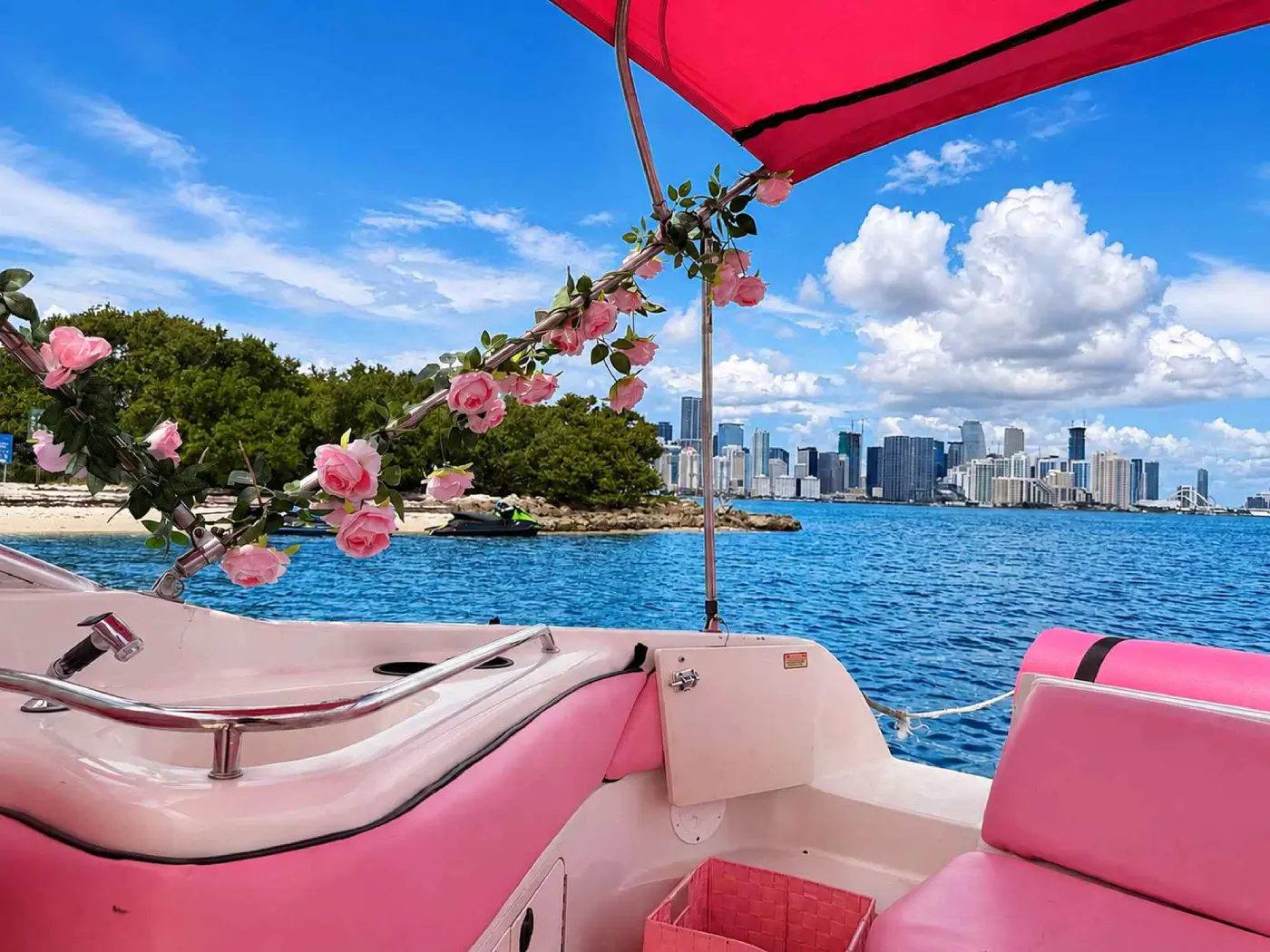 Miami skyline seen from the 26ft pink Sea Ray under the pink shade top