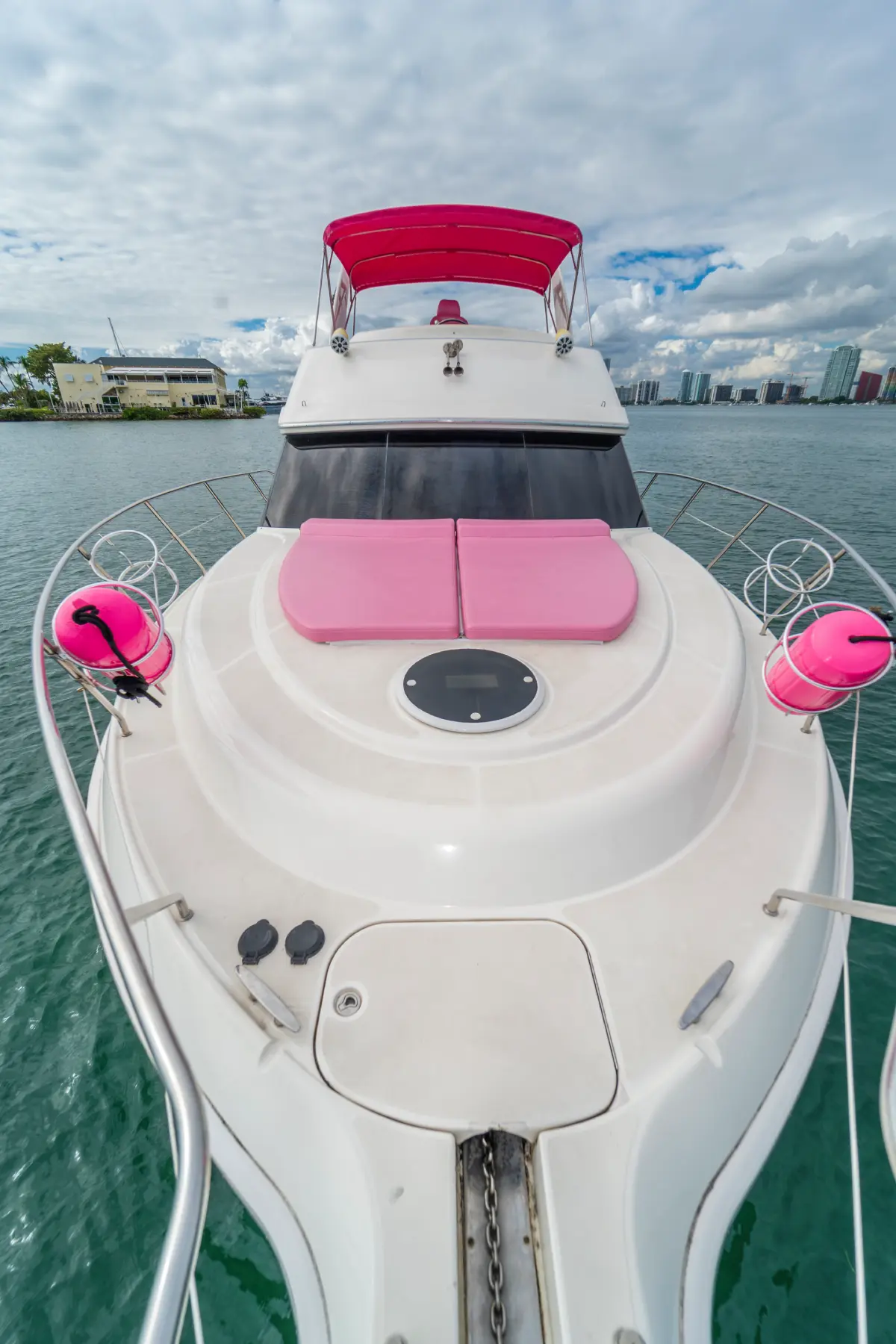 Bow of 41ft pink Silverton yacht Miami with pink sun pads
