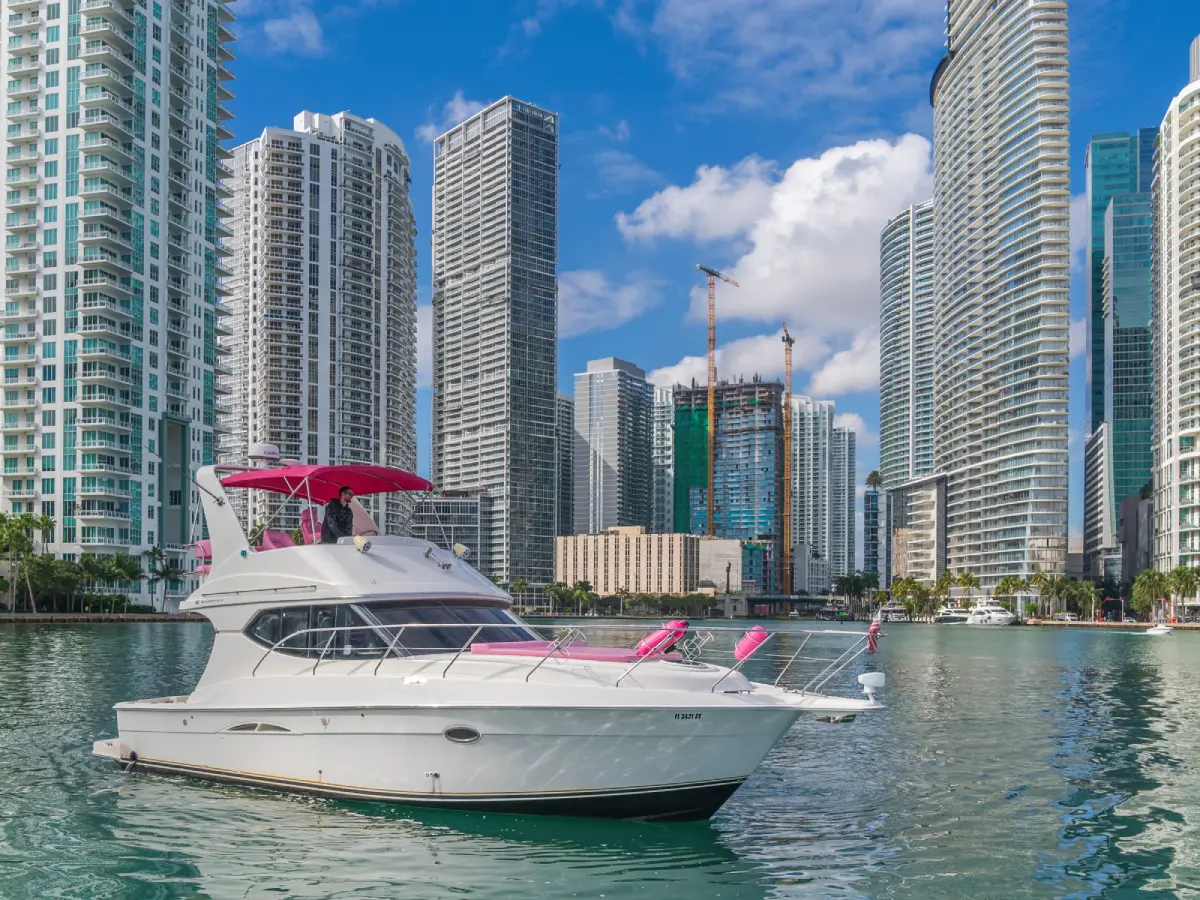 41ft pink Silverton yacht Miami flybridge cruise past downtown Miami towers