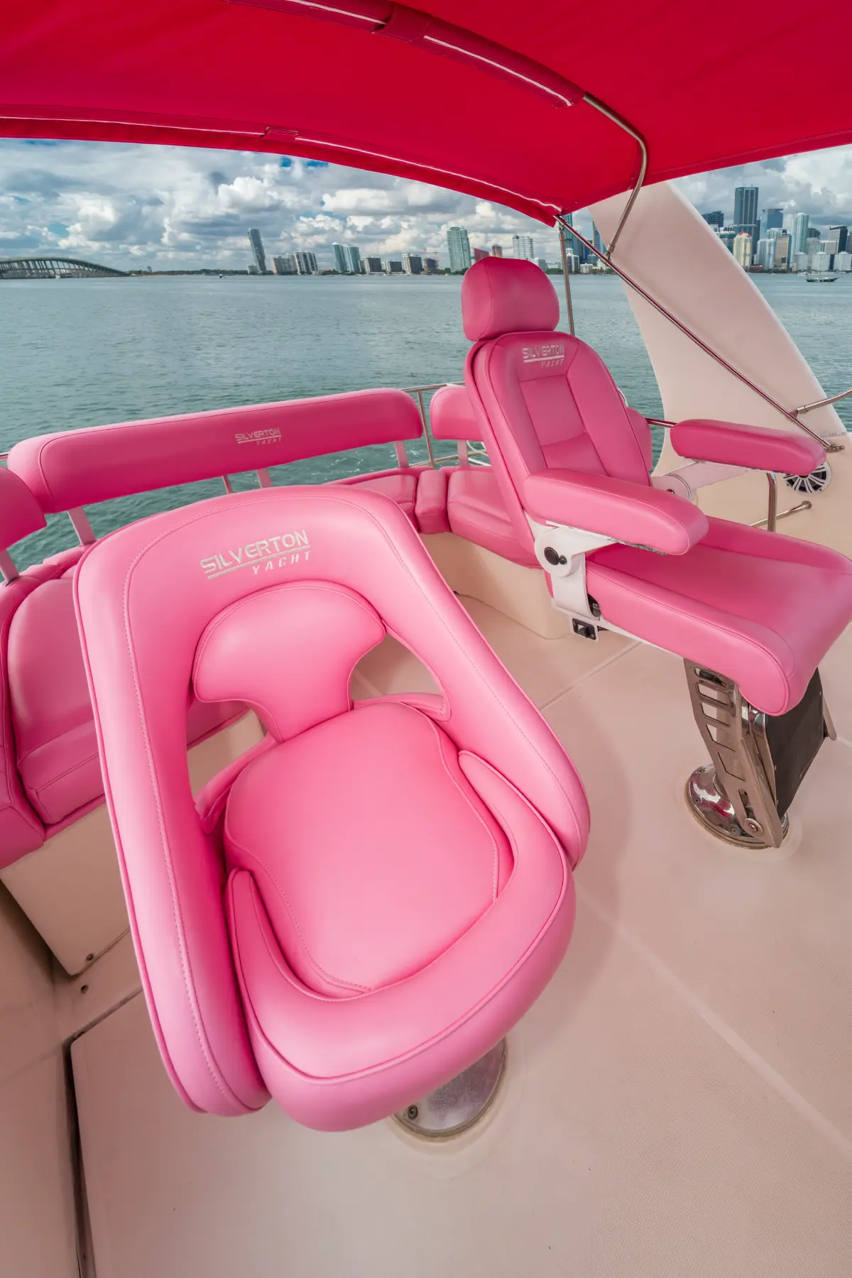 Pink helm seats on the flybridge of 41ft pink Silverton yacht Miami
