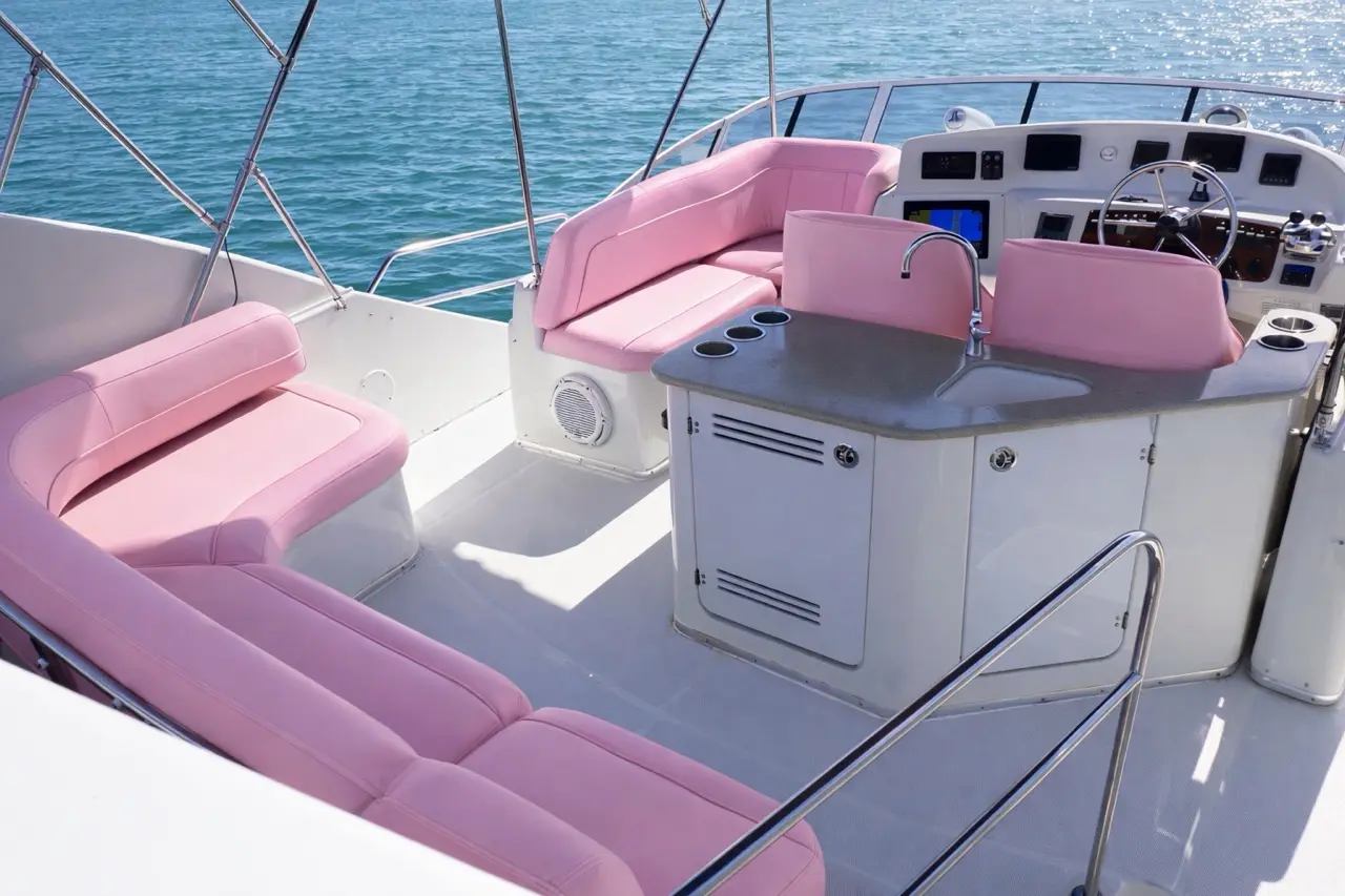42ft pink yacht Miami helm station with pink L-shaped seating