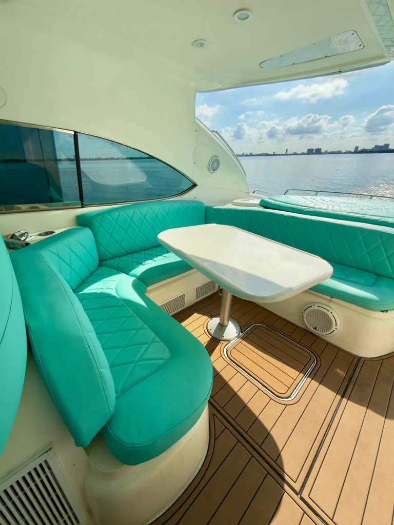 Tiffany blue U-shaped cockpit seating with table on the 60ft Sunseeker Predator