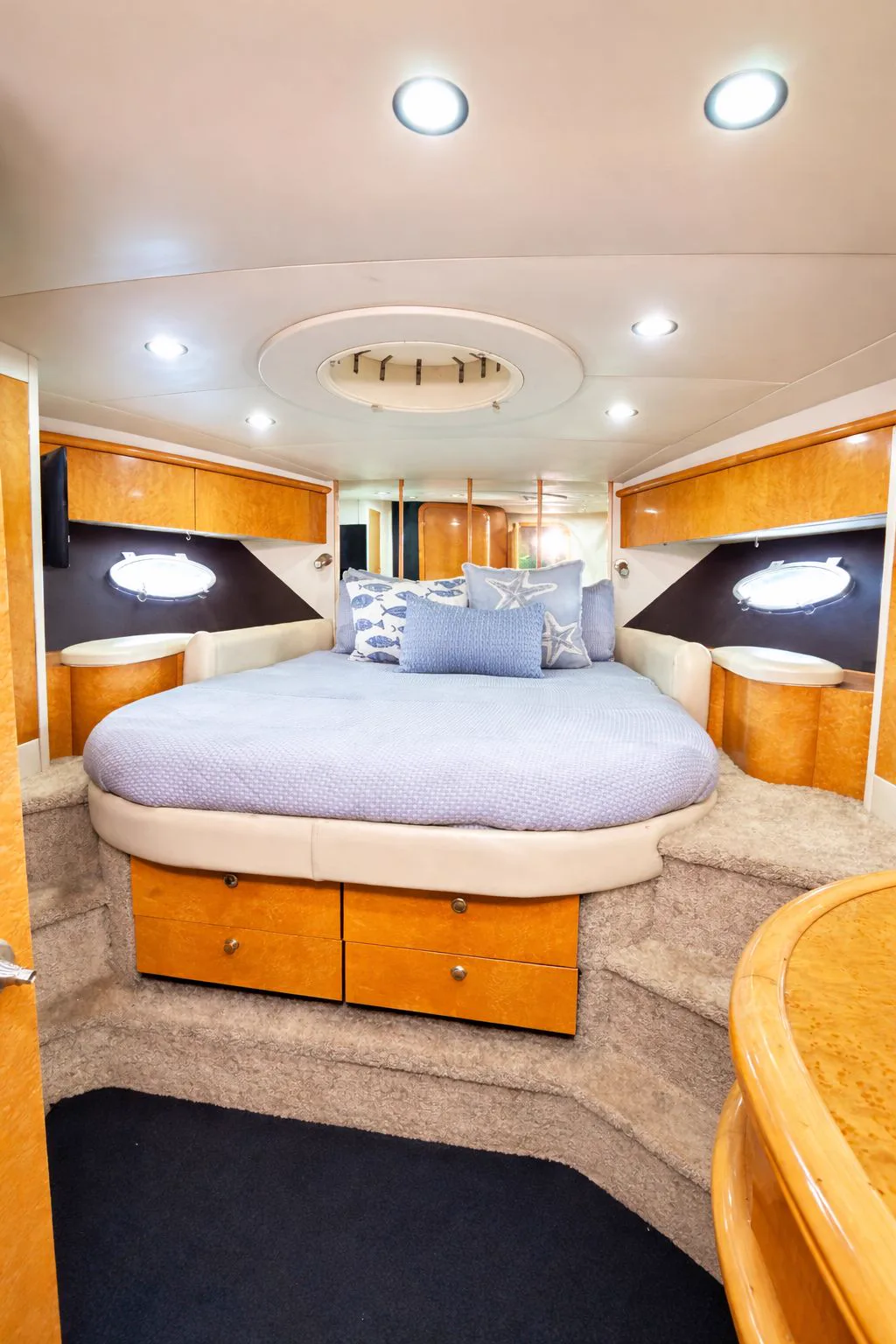 Master stateroom with island bed on the 60ft Sunseeker Predator yacht