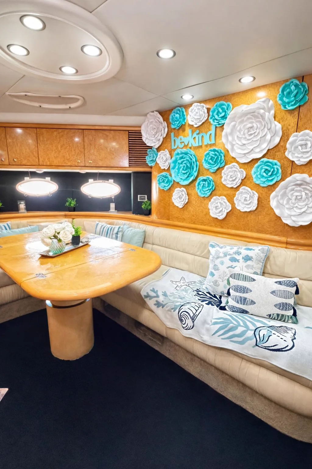 Air-conditioned salon on the 60ft Tiffany Predator yacht with a blue and white flower wall