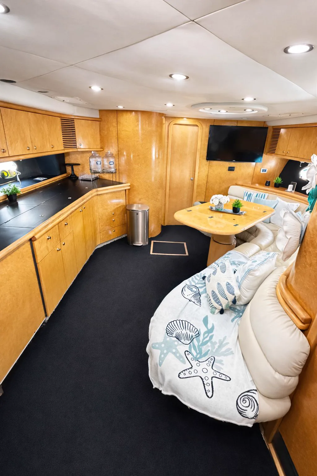 Wide view of the salon and galley inside the Tiffany Predator yacht