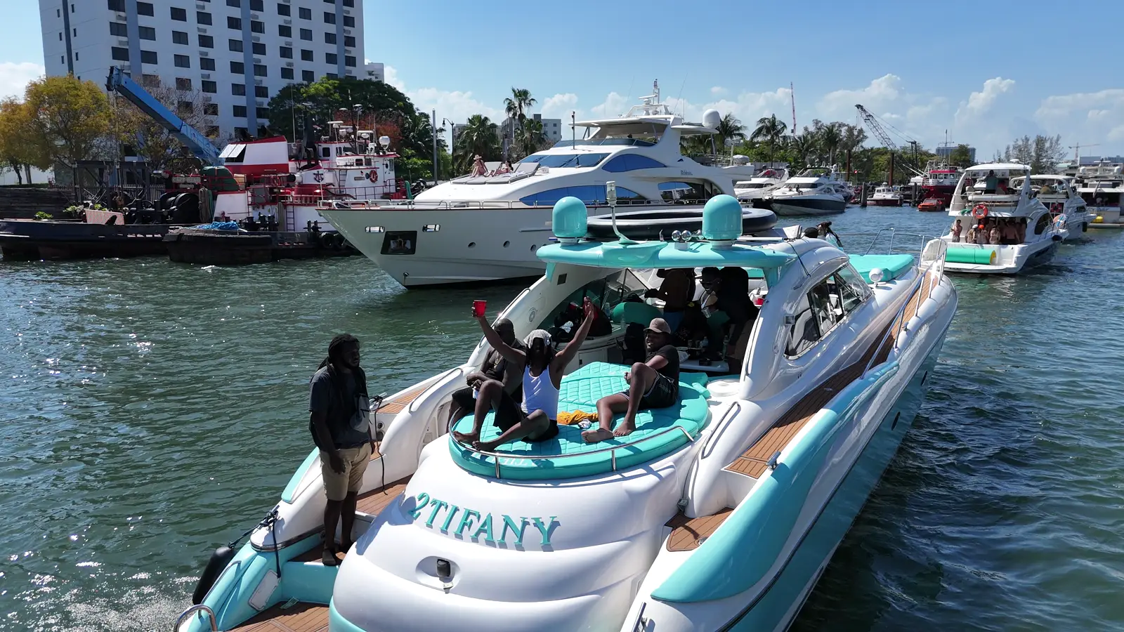 Stern of the Tiffany blue Sunseeker Predator with 2TIFANY name on the Miami River