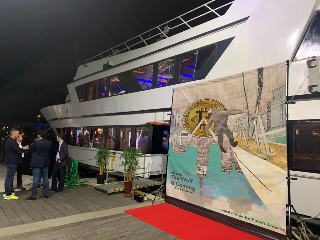 Red carpet and artist banner at the dock for an Art Week yacht event in Miami