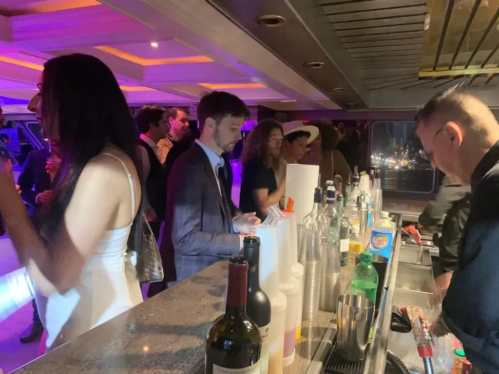 Guests at the open bar inside an event yacht during Art Week in Miami