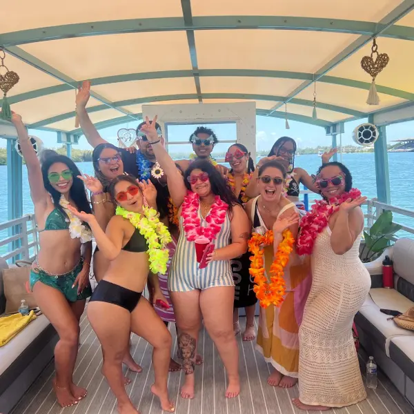 Group having fun on party catamaran deck