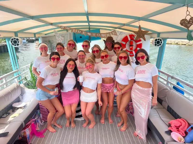 Bride tribe in matching custom shirts celebrating a bachelorette boat party in Miami