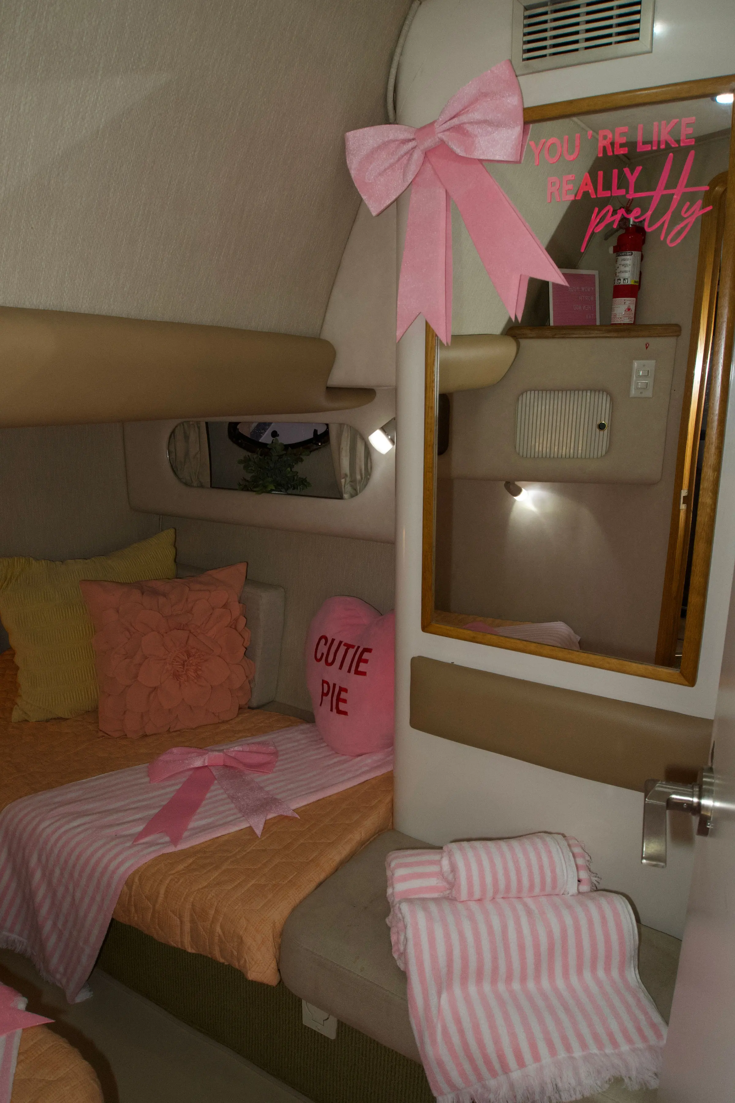 Pink Horizon yacht Miami second stateroom with pink decor and neon sign