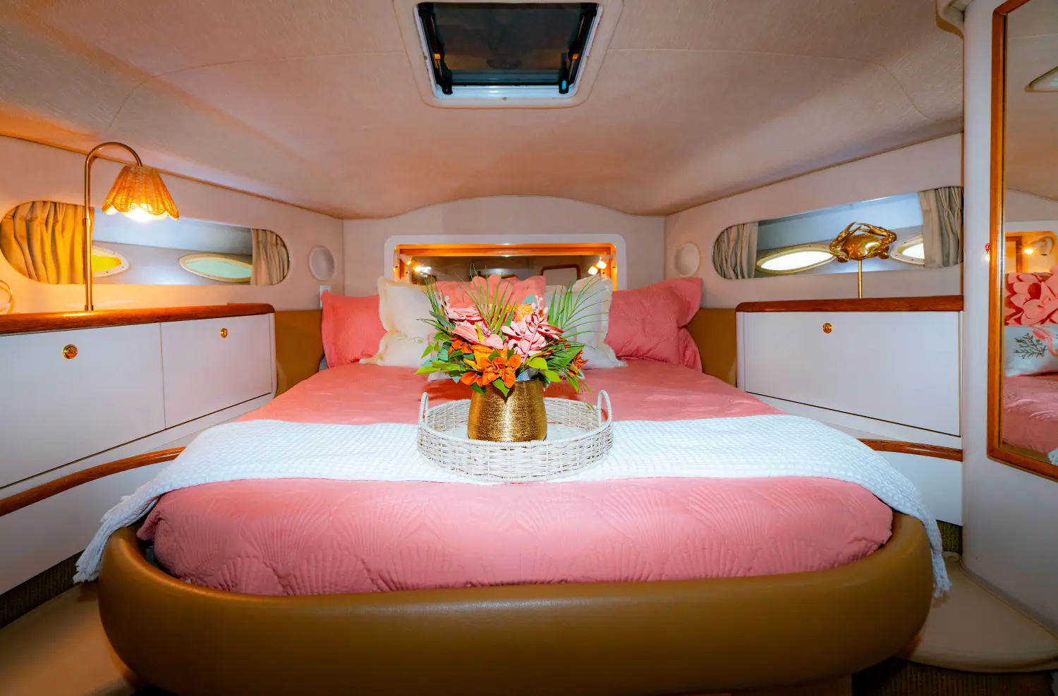 Pink Horizon yacht Miami master stateroom with pink bedding and tropical flowers