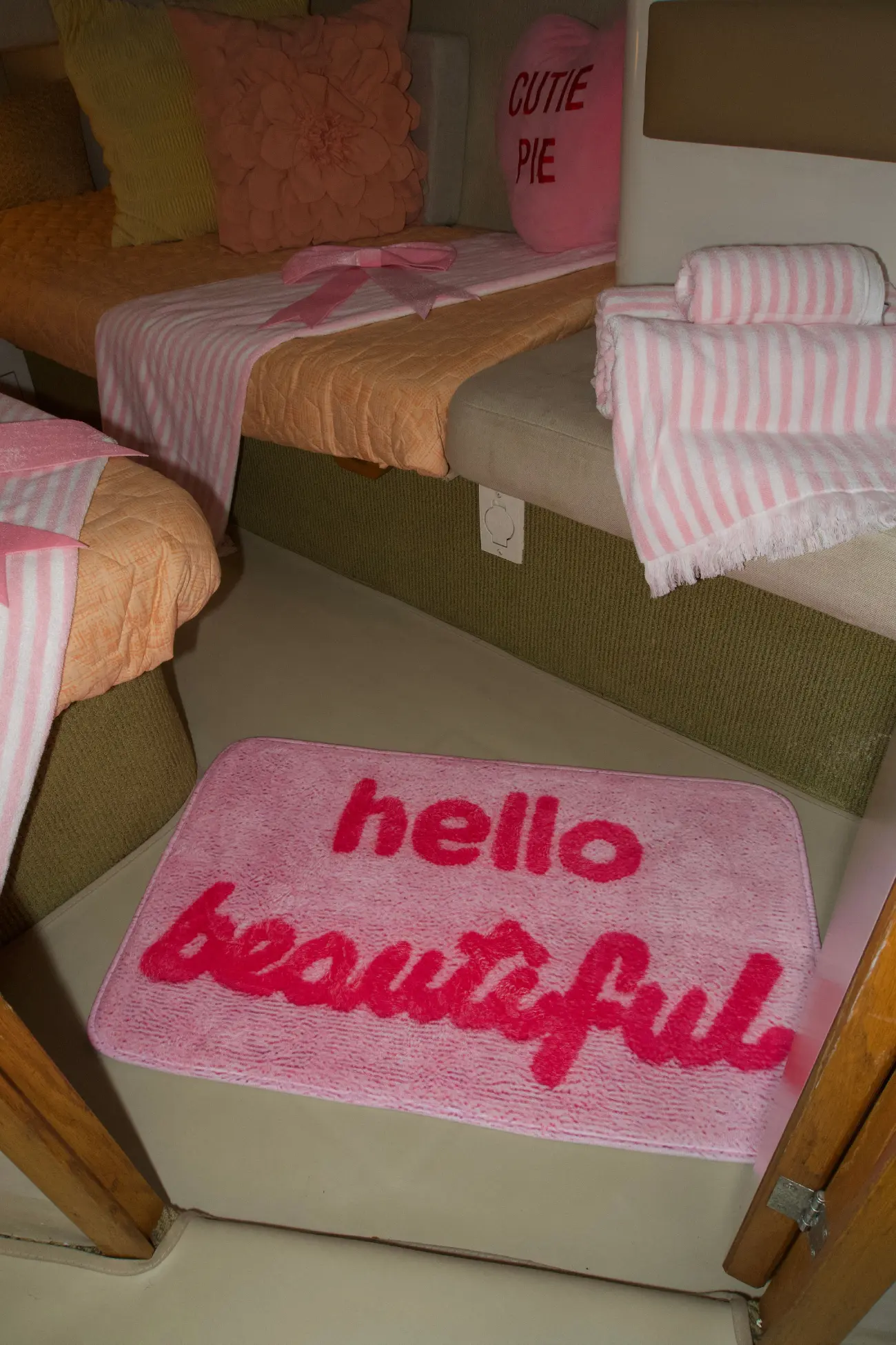 Pink Horizon yacht Miami stateroom with hello beautiful floor mat