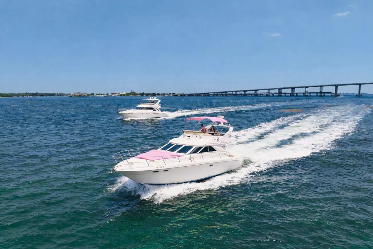 Two Pink Horizon yachts cruising together Miami private yacht charter for larger groups