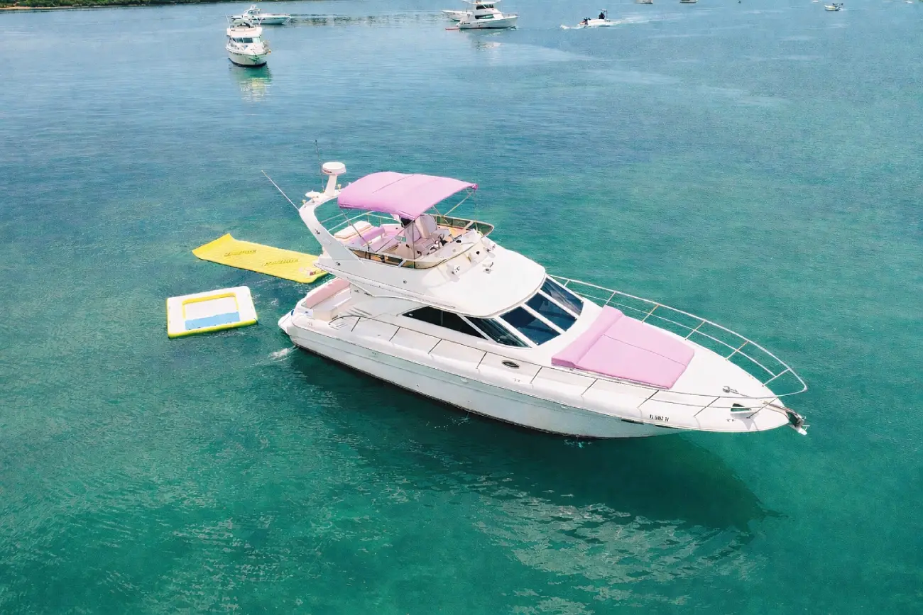 50ft Pink Horizon yacht Miami anchored with water toys and aqua mat deployed
