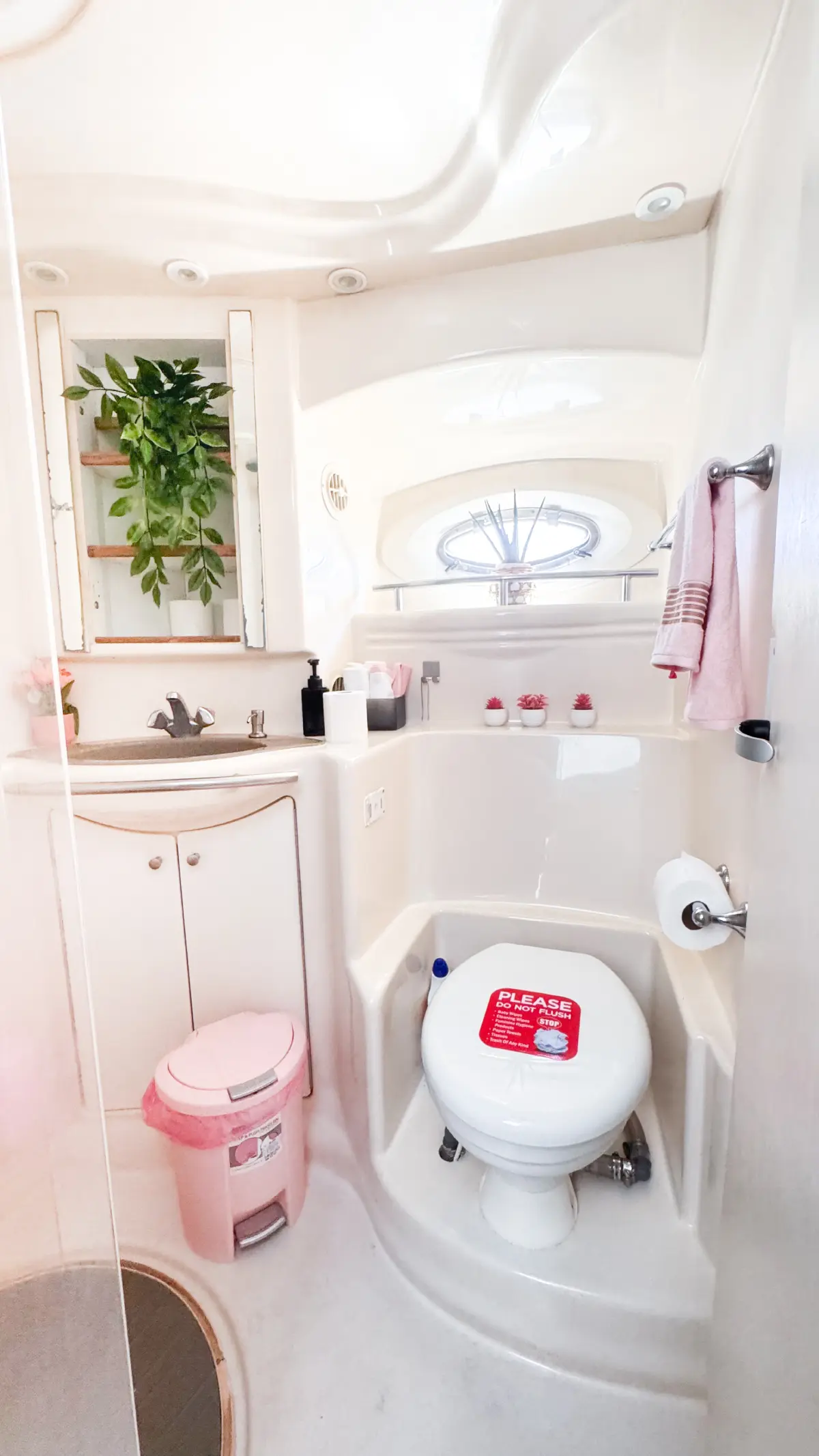 Pink yacht Miami bathroom with shower and pink accents