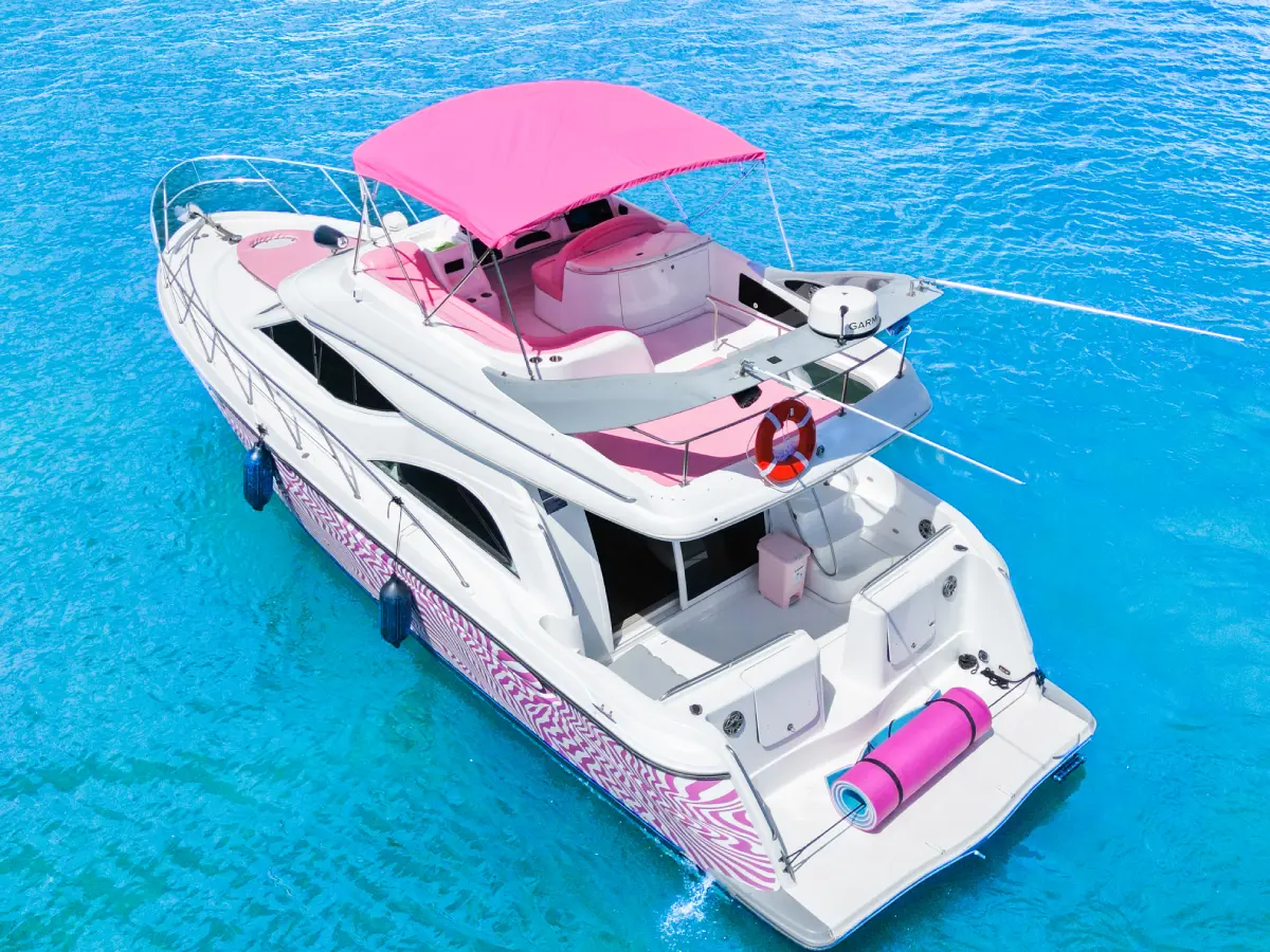 Pink Maxum yacht aerial view with flybridge and floating mat Miami charter