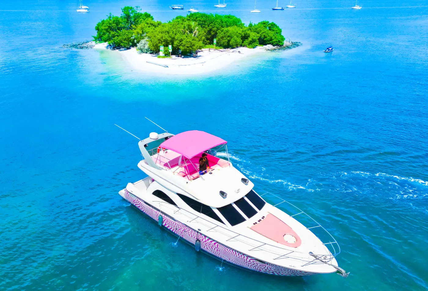 Aerial view of 46ft pink Maxum yacht Miami near a small island on Biscayne Bay