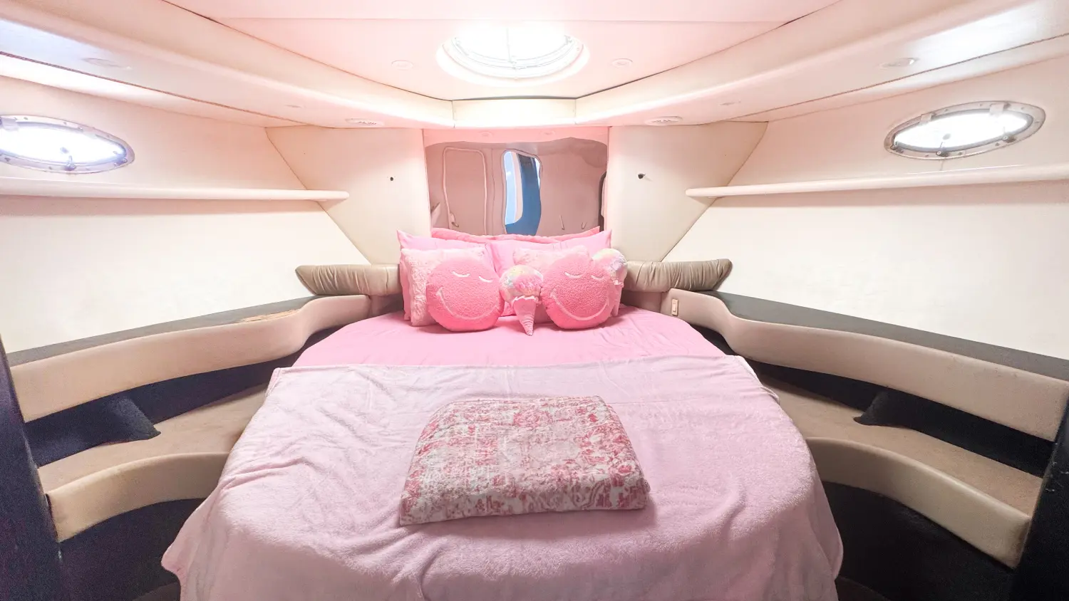 Pink Maxum yacht Miami stateroom with pink bedding and pink pillows