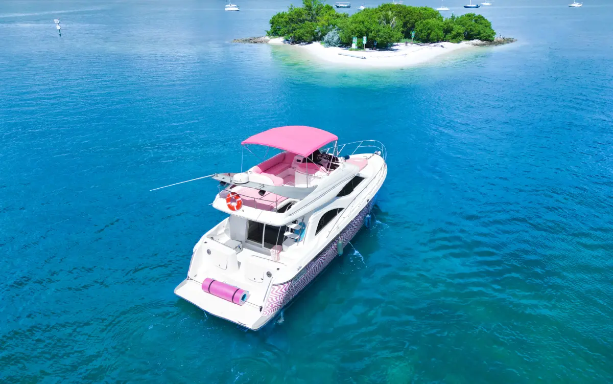 46ft pink Maxum yacht Miami anchored with floating mat at the stern