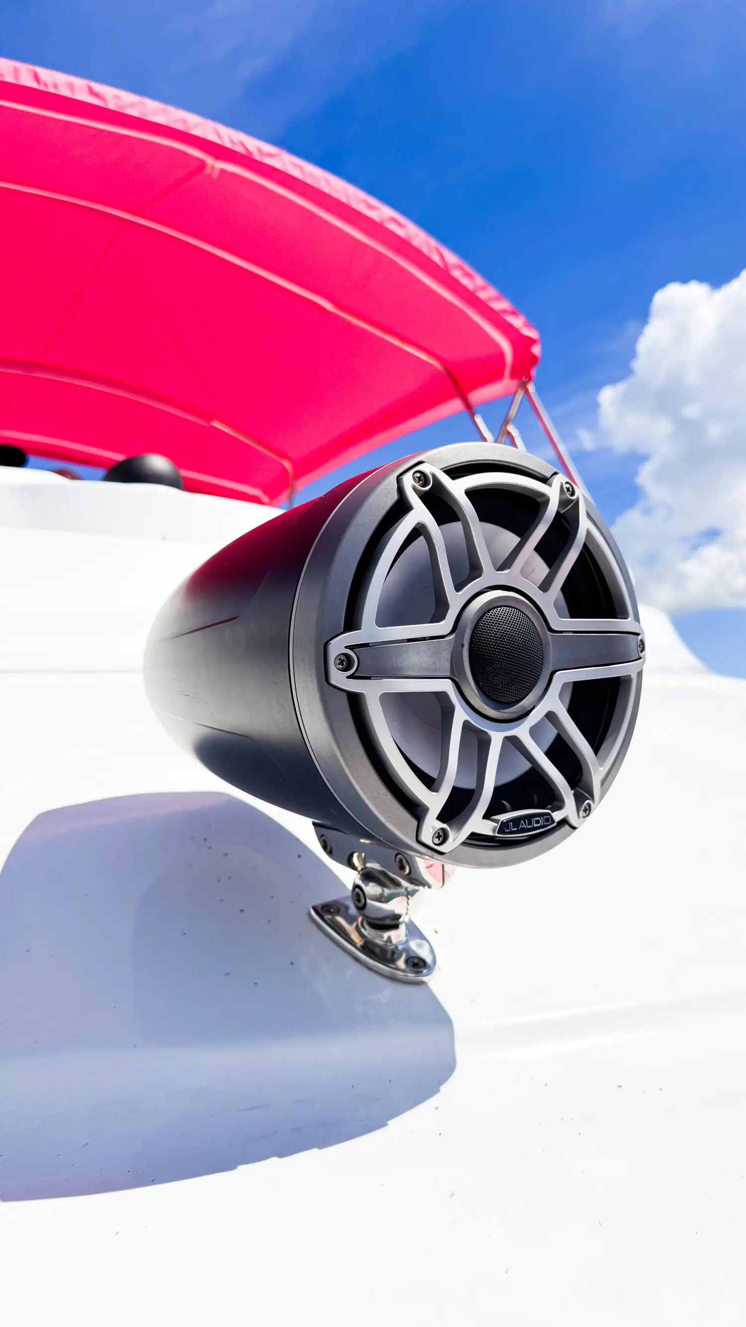 Bluetooth speaker on pink yacht Miami flybridge canopy
