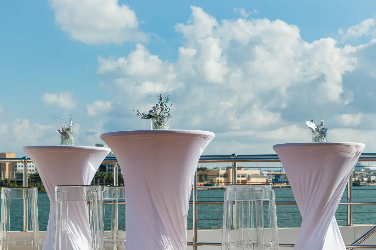 Guests networking on deck during a corporate retreat yacht event in Miami