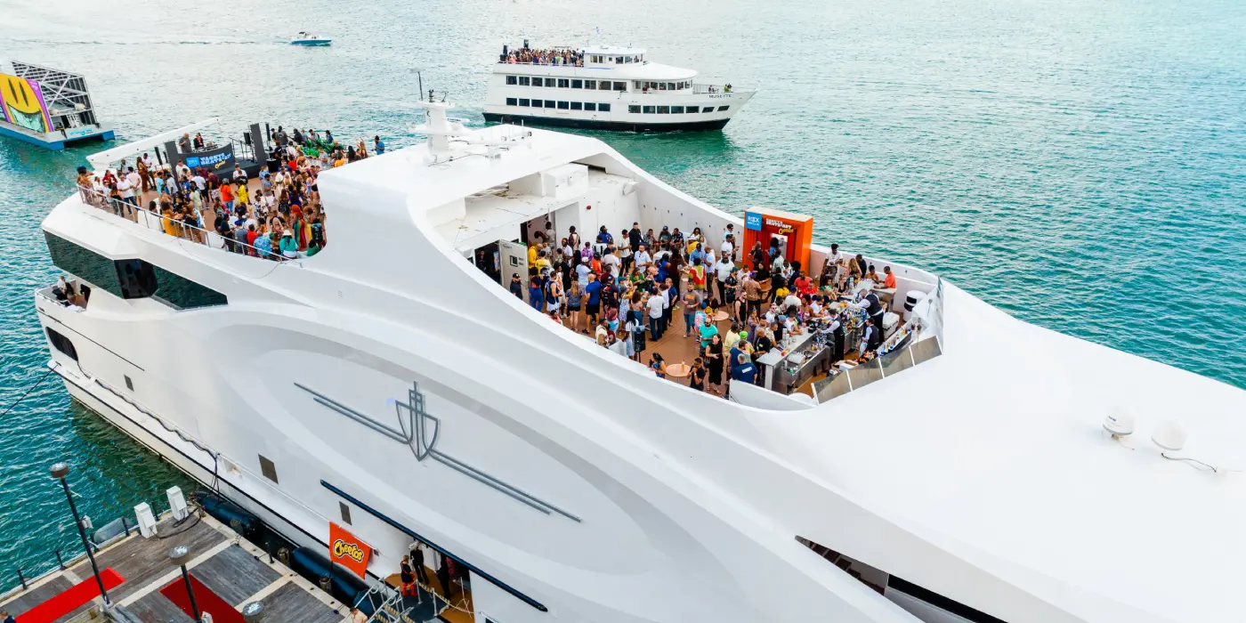 A spectacular drone aerial shot of the 228ft Sea Yacht cruising in Miami's turquoise waters