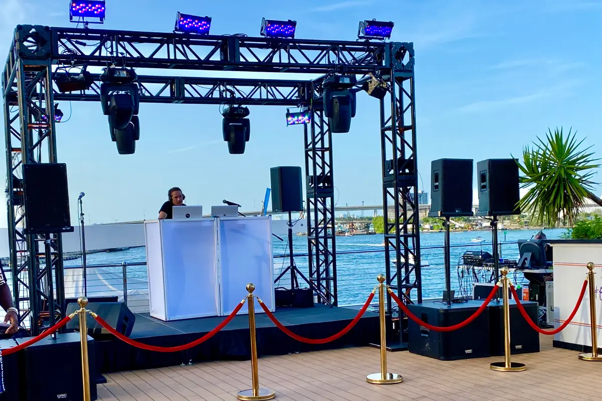 Professional lighting tower and projectors on the sky deck for a custom corporate yacht party in Miami