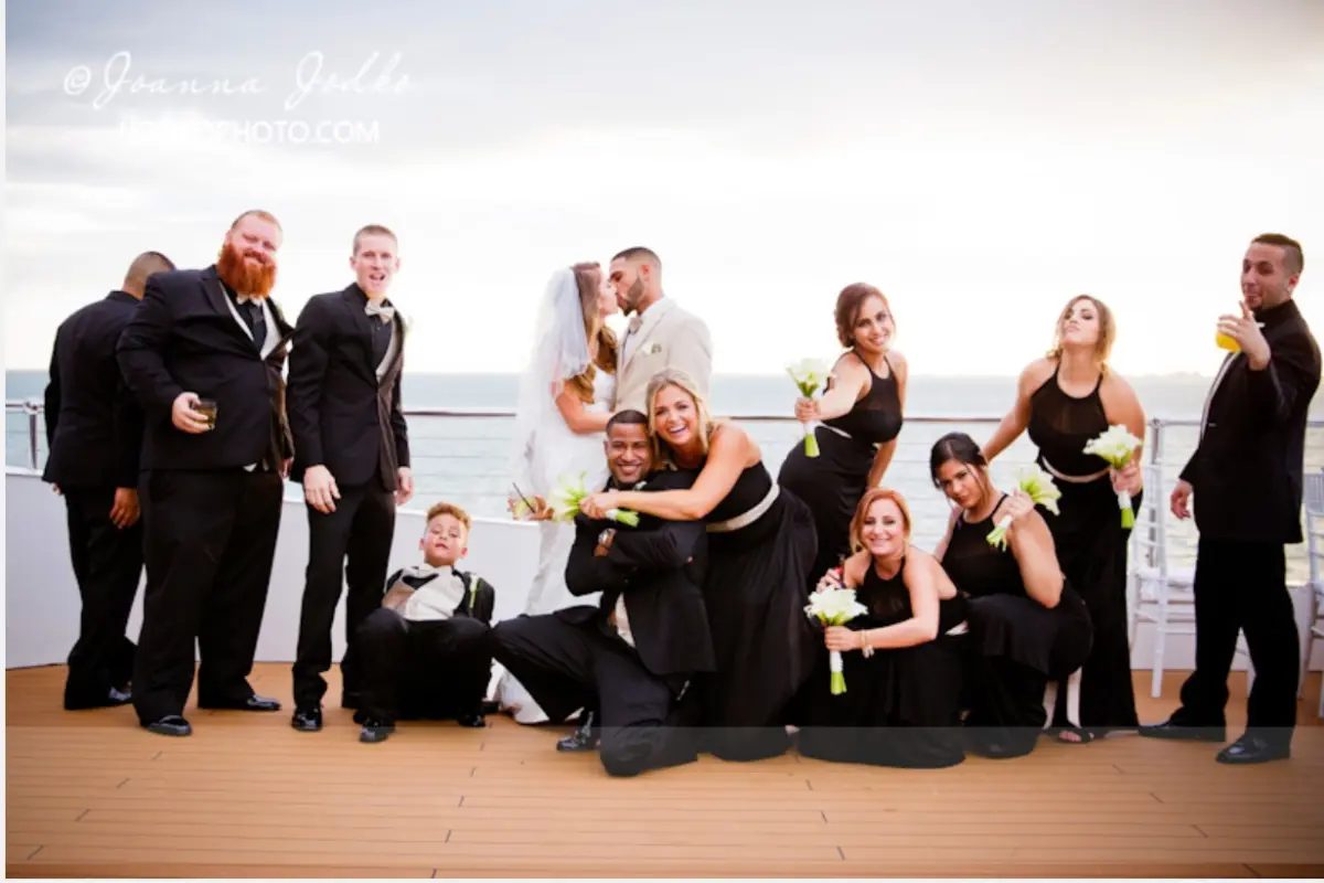 A wedding party posing on the stern of the Sea Yacht for a wedding on a yacht in Miami