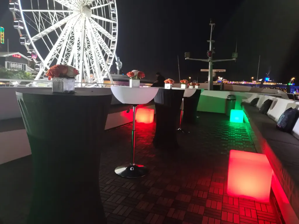 VIP cocktail tables and LED cubes on a yacht deck for an Art Basel private event in Miami