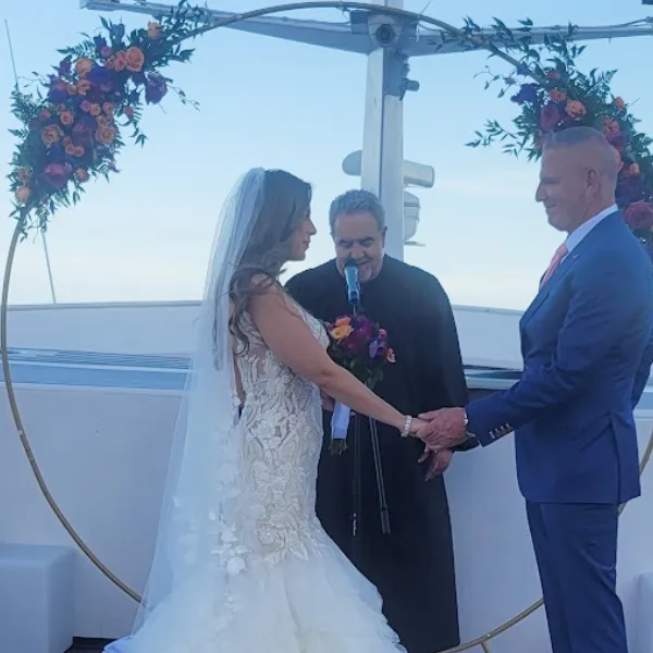 Intimate wedding ceremony on yacht deck Miami