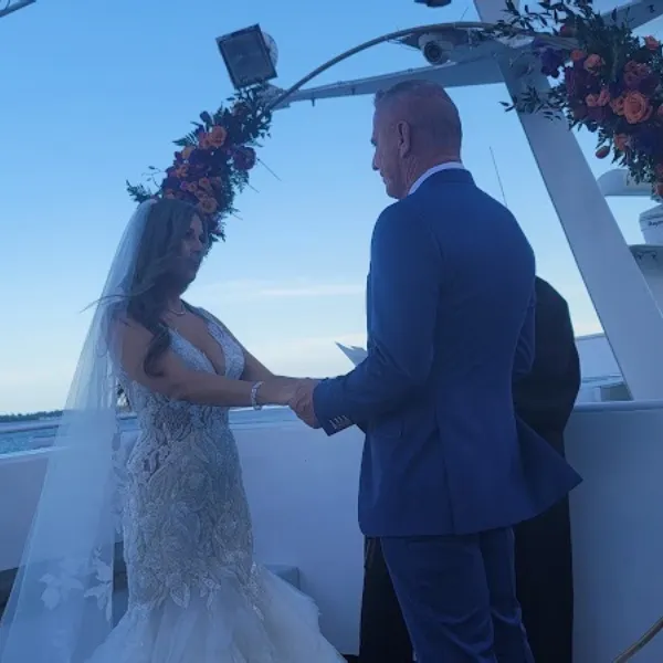 Bride and groom vows on yacht deck in Miami